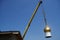 A crane lifted the bright golden dome of the Christian church for installation and assembly on the roof of the temple under