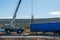 Crane lifting a crashed semi-trailer