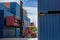 Crane lifting up container in railroad yard. Crane lifting up container in yard. forklift handling container box loading.