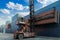 Crane lifting up container in railroad yard. Crane lifting up container in yard. forklift handling container box loading.