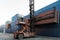 Crane lifting up container in railroad yard. Crane lifting up container in yard. forklift handling container box loading.