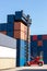 Crane lifting up container in railroad yard. Crane lifting up container in yard. forklift handling container box loading.