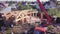 Crane lifts on cables wooden structure. Clip. Top view of process of building wooden country house with crane. Crane