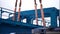 Crane lifts heavy iron detail. Clip. Industrial iron large metal gantry crane with a hook mounted on the supports for
