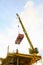 Crane operation transfer cargo on the platform and moving cargo from supply boat, heavy lift in oil and gas construction platform