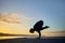 crane posture, yoga pilates. girl practicing outdoors