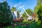 A crane is seen removing a large tree trunk from a house after it fell during a storm