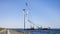 Crane ship lifting propeller for demolition offshore wind turbine farm