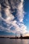 Crane silhouettes in the dock with spectacular sky