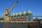 Crane and silos of a gravel plant on a pier