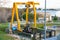 Crane to collect filter residues in a sewage treatment plant