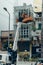 Crane truck on road for group of people working in Saigon,Vietnam, Vietnamese worker work on boom lift to cut branch of tree for