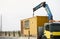 Crane truck unloading portable workers house container booth