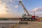 Crane trucks in the construction of a bridge