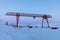 Crane in winter landscape at Pyramiden, Svalbard.