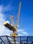 Crane work in construction site with blue sky background