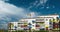 Crane working at construction site of modern residential building in Torino, Italy. Scenic time lapse with blue sky and fast movin