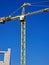 crane works on the construction of a house