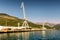 Cranes at cargo terminal in Kotor bay. Montenegro docking station with cranes and tug boats.