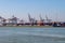 Cranes and lots of containers in the container terminal, Rotterdam harbor.