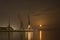 Cranes in the port and reflection of moon