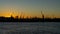 Cranes skyline sunset in Hamburg Harbor