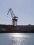 Cranes to repair boats in the bay of Cadiz capital, Andalusia. Spain.