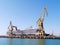 Cranes to repair boats in the bay of Cadiz capital, Andalusia. Spain.