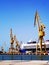 Cranes to repair boats in the bay of CÃ¡diz capital, Andalucia. Spain.