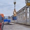 Cranes unloading a freight transport