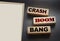 Crash boom bang words on wooden blocks on black. crisis concept