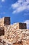 Crash stone ramparts against the white clouds and blue sky