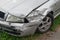 Crashed silver car front fender insurance accident broken collision damage