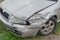 Crashed silver car front fender insurance accident broken collision damage