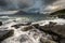 Crashing waves at Elgol on the Isle of Skye with Cuillin Range in the background.
