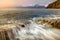 Crashing waves on Inner Hebrides coastline with dramatic Winter stormy rain clouds in the sky. Taken at Elgol on the Isle of Skye.