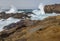Crashing waves at rocky ocean cliffs