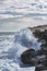 Crashing waves on rocky shore - color