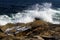 Crashing waves on volcanic rock