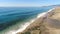 Crashing waves with white sea foam on coastline in sunny Mahmutlar. Flying copter over Mediterranean sea in Antalya