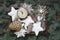 Crate full of Christmas white wooden ornaments for decor on wooden board. View from above. Holiday card. Xmas