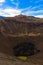 Crater of Bromo volcano against blue sky with clouds. Bromo Teng