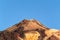 Crater Of The Highest Peak Behind Formations Of Lava Rocks On A Sunny And Very Clear Day In El Teide National Park. April 13, 2019