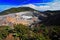 The crater and the lake of the Poas volcano in Costa Rica. Volcano landscape from Costa Rica. Active volcano with blue sky with cl