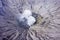 Crater of mount Bromo with volcanic smoke