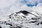 Crater of Mount Etna volcano in winter, Sicily island, Italy. Landscape of Silvestri craters with black volcanic lava