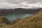 Crater of a mountain with a lake, detail of mountains aligned in the landscape. Ecuador, Quilotoa