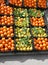 crates of oranges and yellow organic lemons with green leaves fo