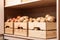 Crates with potatoes and onions on shelf