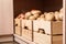 Crates with potatoes on shelf. Orderly storage